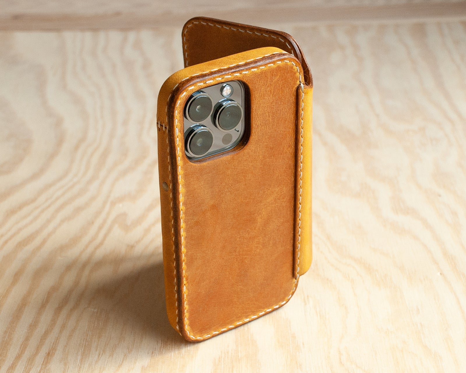 Honey leather iPhone wallet folio open, showing card slots, Ravenweave
