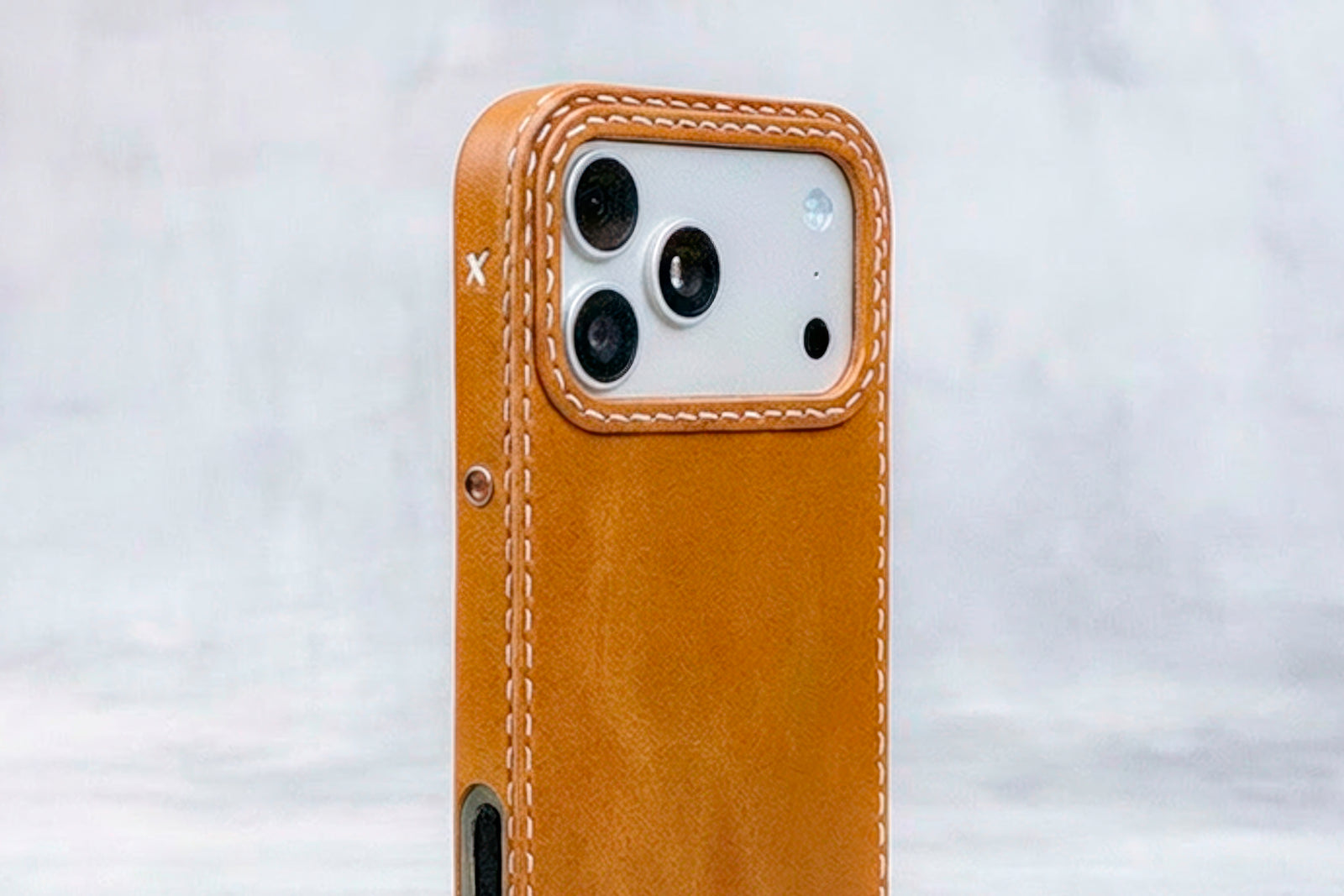 Honey oil-waxed leather iPhone case by Ravenweave, warm golden finish